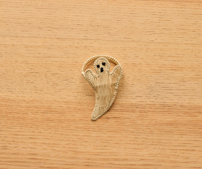 Handmade rattan ghost napkin ring on neutral background – Halloween-themed rustic boho table decor accessory