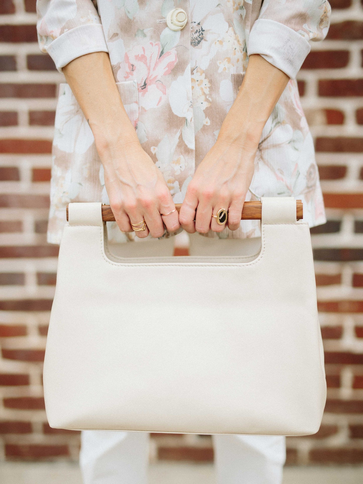 Italian Leather Tote Handbag- model holding Wood cut out white Tote Handbag by Payton James