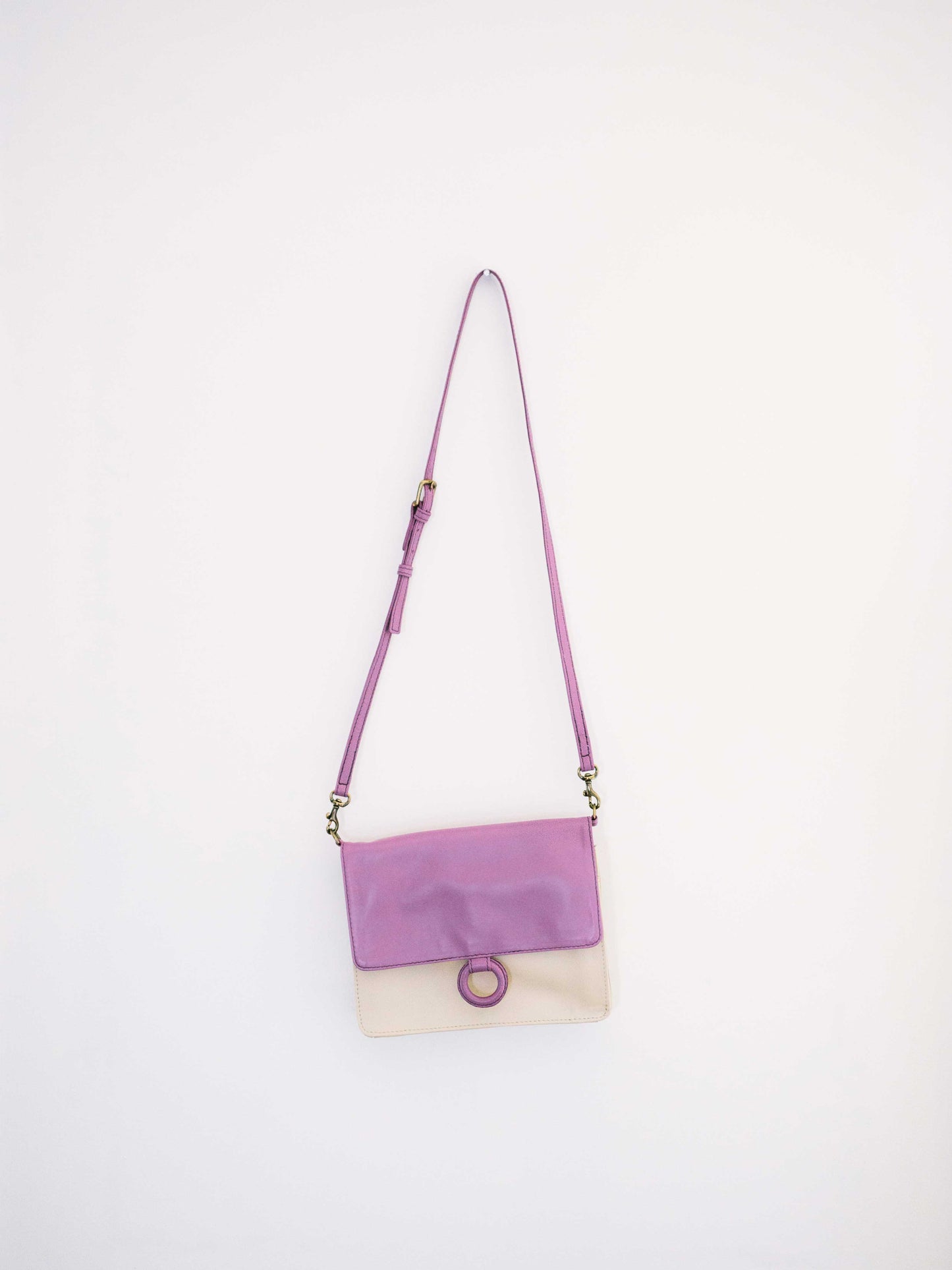 Lavender Leather Crossbody Wallet bag  displayed on white wall-by Payton James Nashville Handbag designer