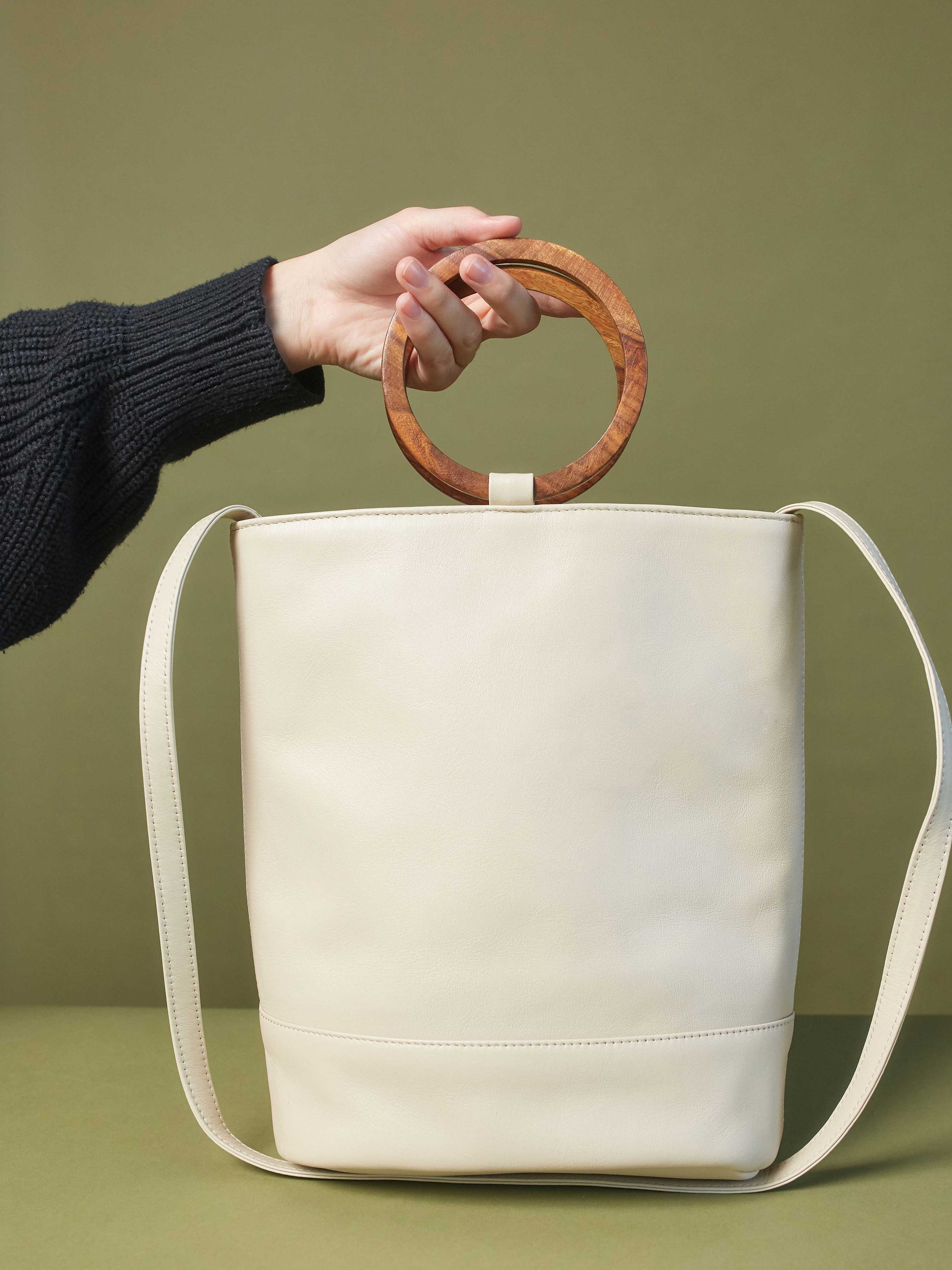 White Leather Tote and Crossbody Handbag by Payton James: Nashville Handbag Designer model holding bag 