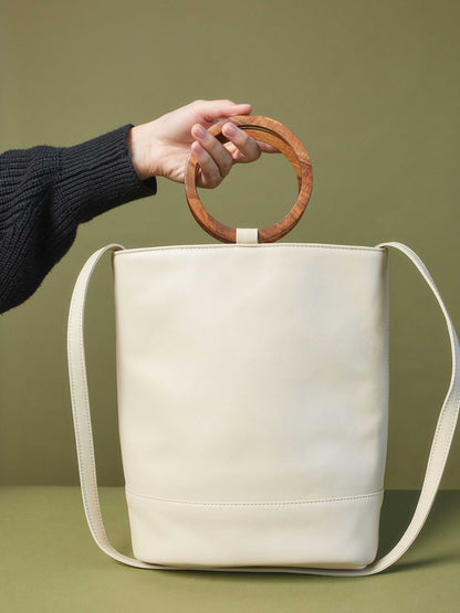 White Leather Tote and Crossbody Handbag by Payton James: Nashville Handbag Designer model holding bag 