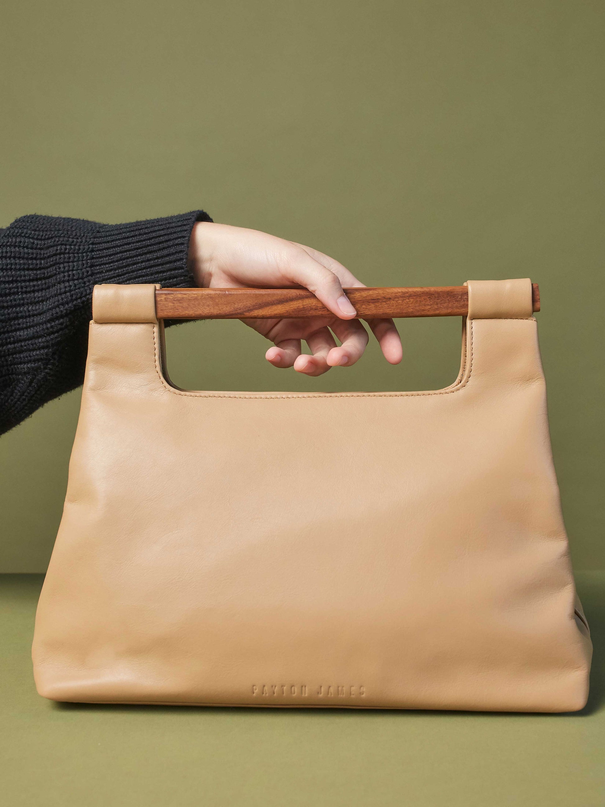 Leather-Tote-Handbag-Wood-Cut-Out-Tote-by-Payton-James-Cappucino-Tan-Color model holding bag
