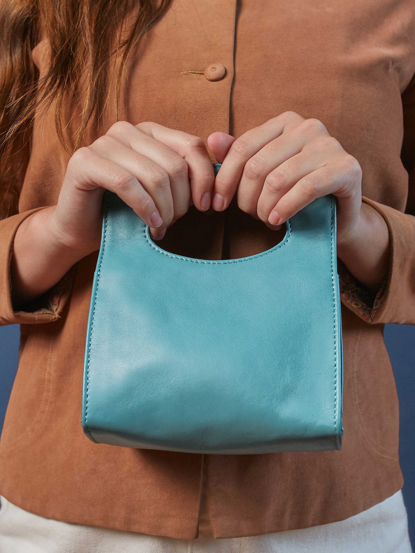 Leather-Crossbody Handbag- Emerald Color-by-PaytonJames-Nashville-designer. model holding bag