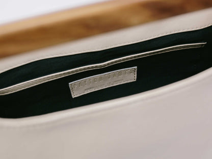 Italian Leather Tote Handbag- close up of nametag Wood Cut Out Tote Handbag by Payton James