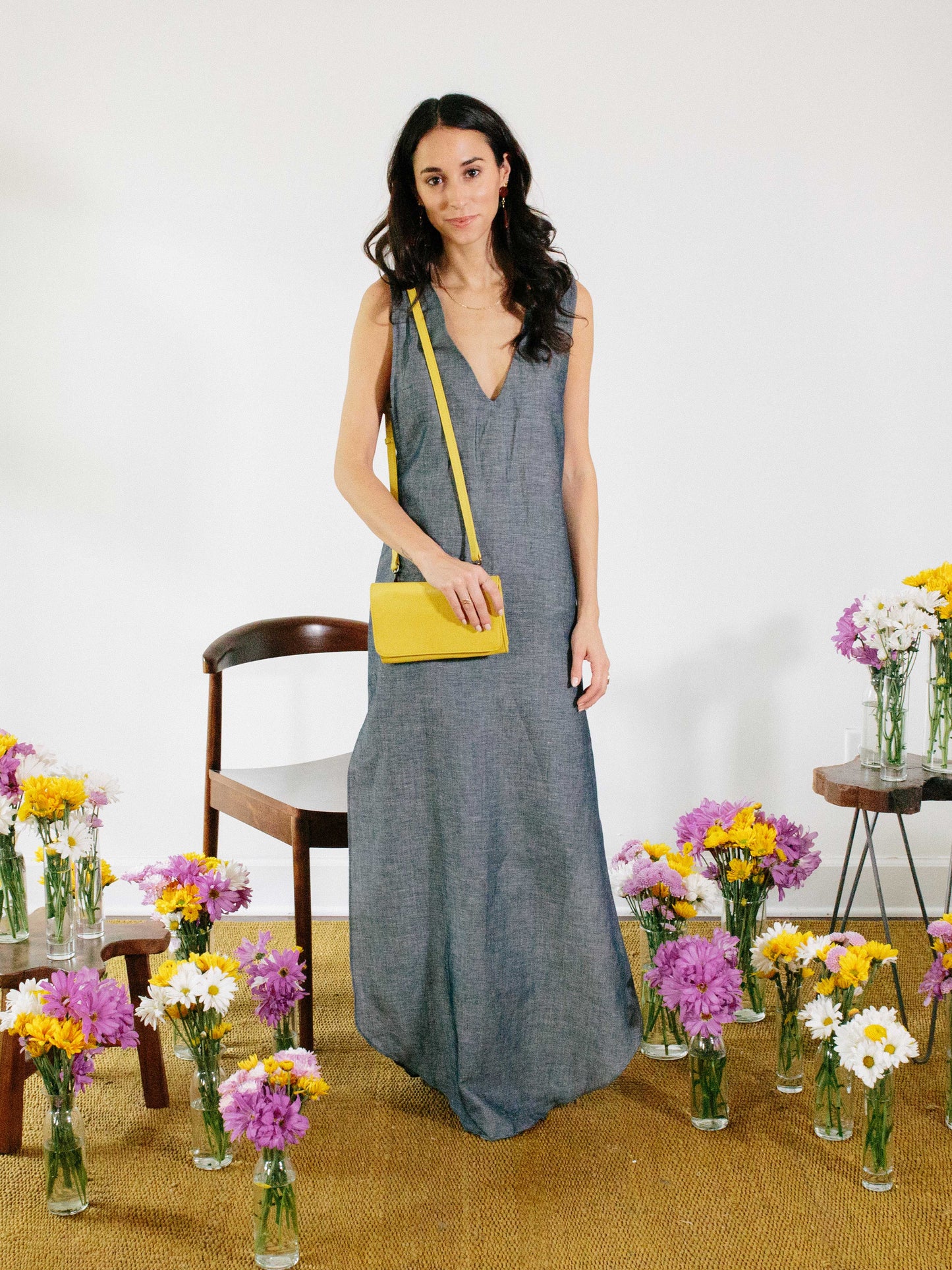 model posing with yellow travel wallet by payton james