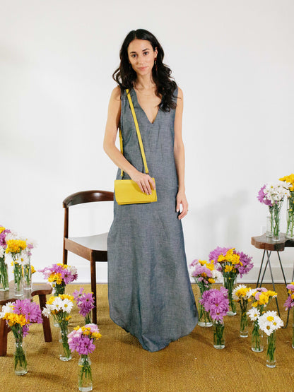 model posing with yellow travel wallet by payton james